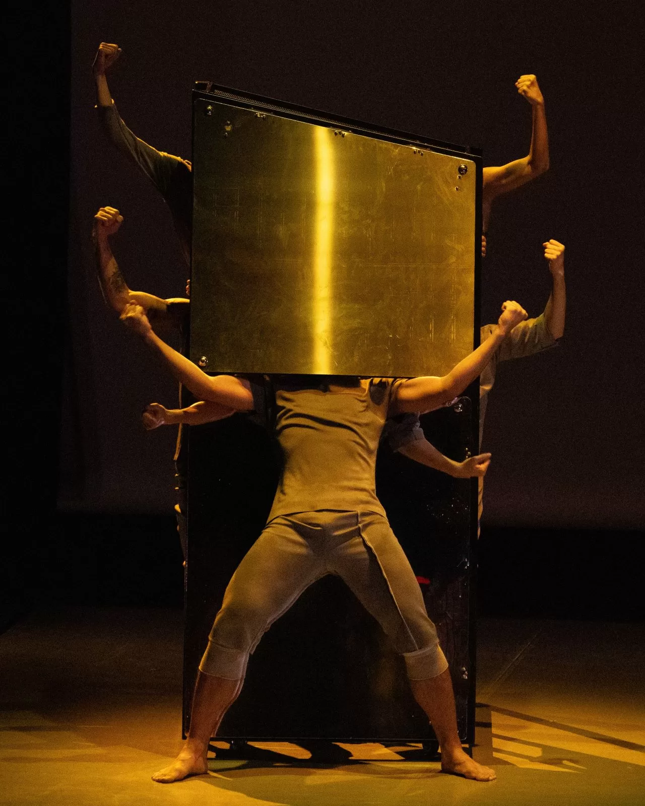 Dancers create an optical illusion to explore connections through a dismembered body